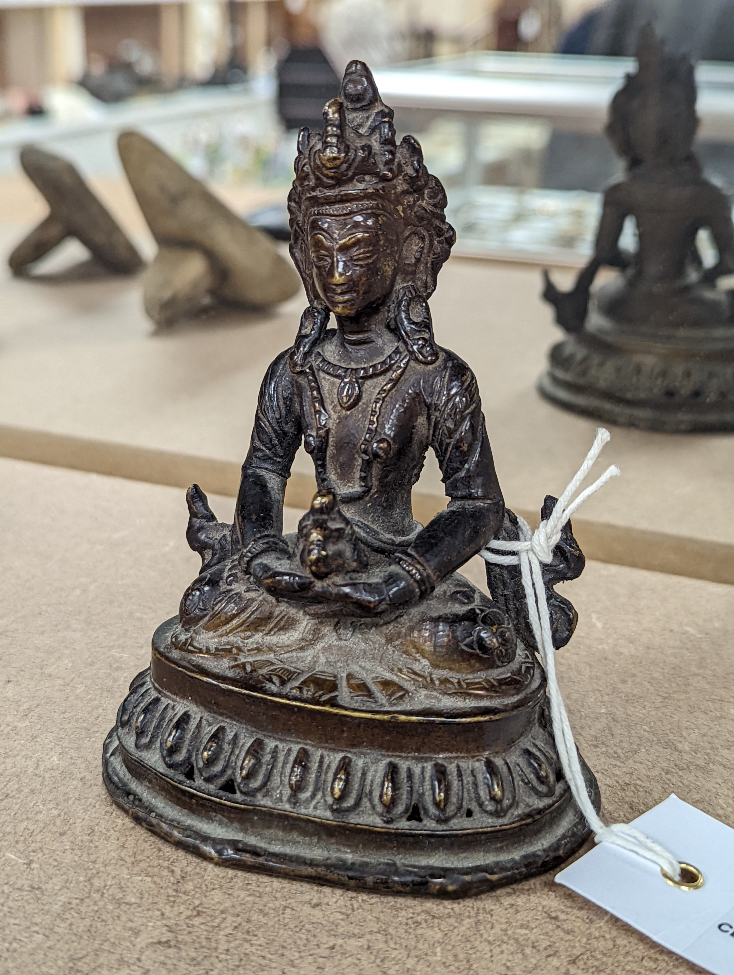 A 19th/20th century Himalayan bronze buddha 12cm